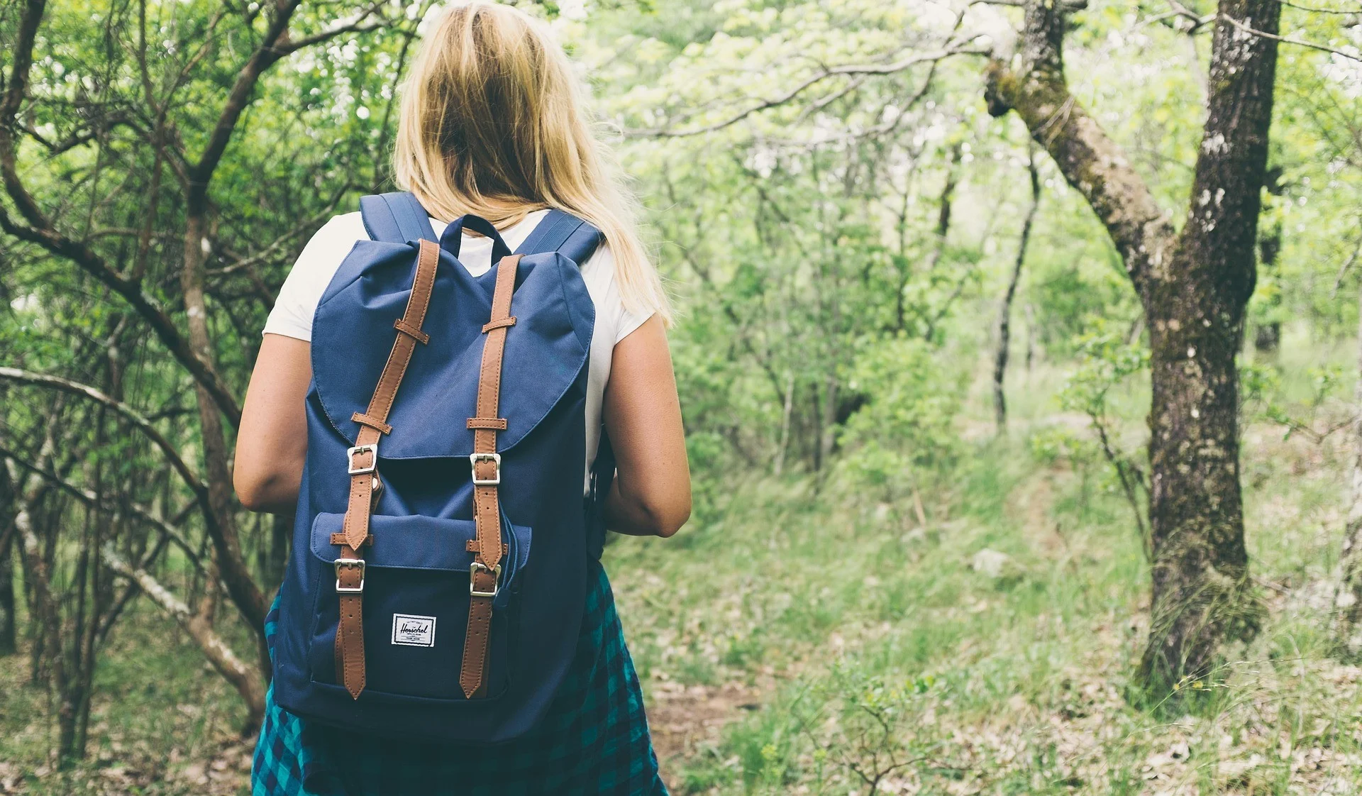 Woman hiking on forest trail during Hot Lowveld Summers in Mbombela Lowveld